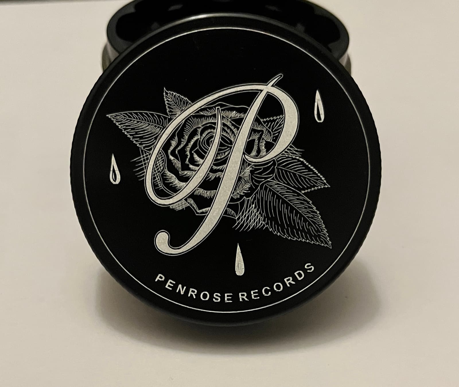 Custom branded grinder machined for Penrose Records